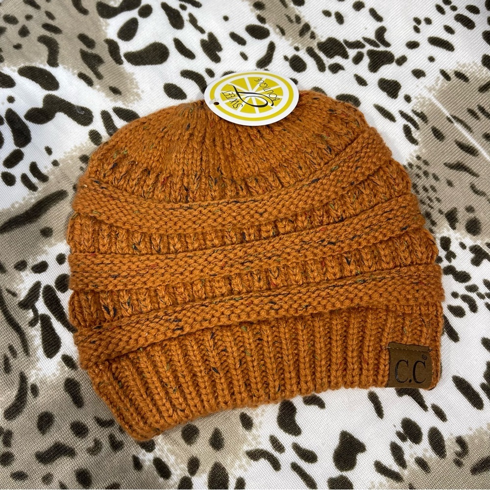 CC Boutique Warm Knit Hat in Rust Orange messy bun top